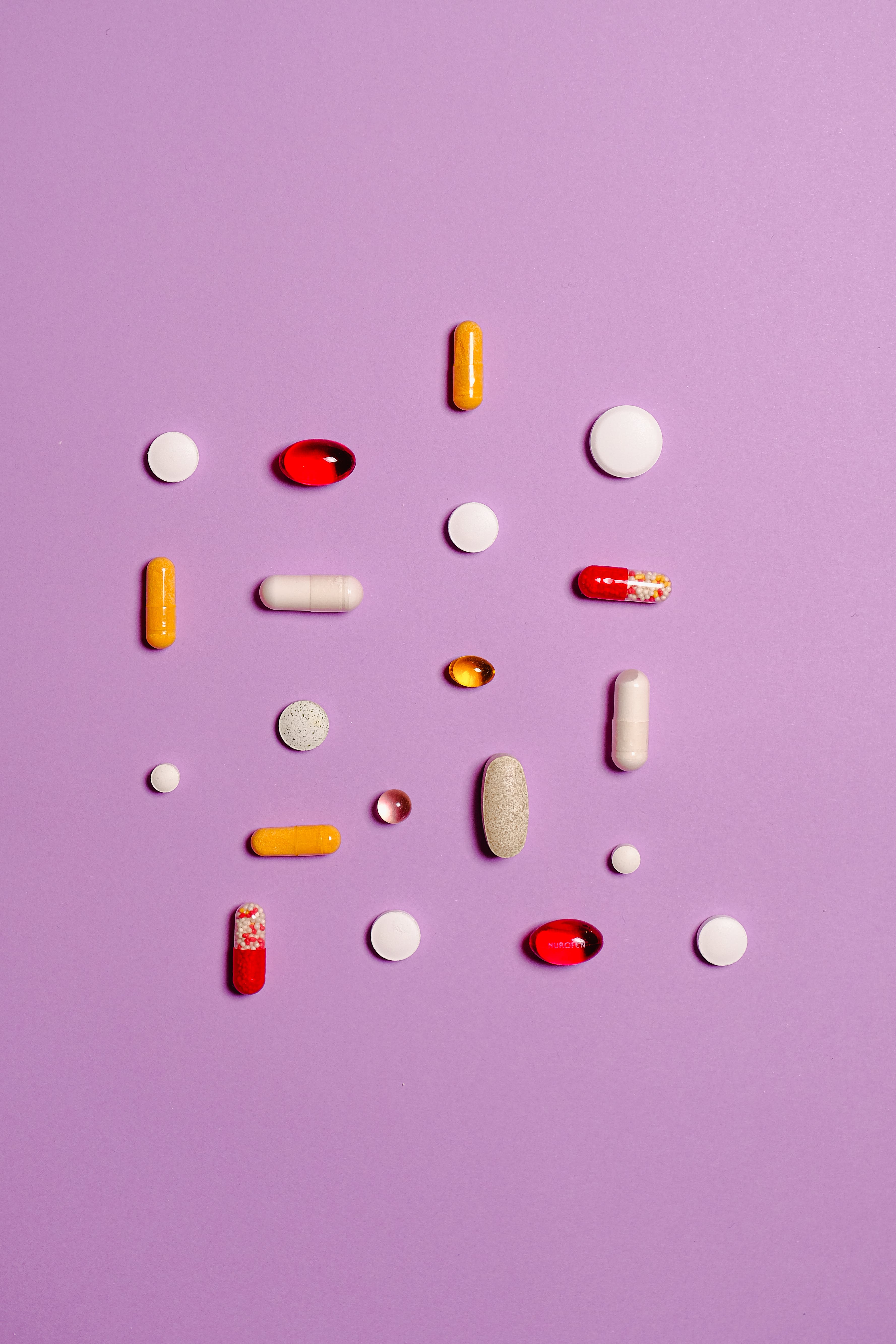 Medication Pills Isolated on Purple Background